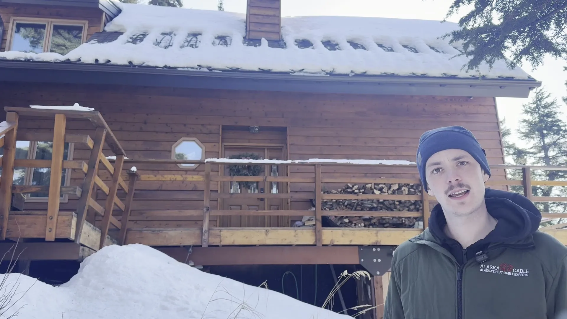Luke, owner of Alaska Heat Cable, at a snowy cabin install